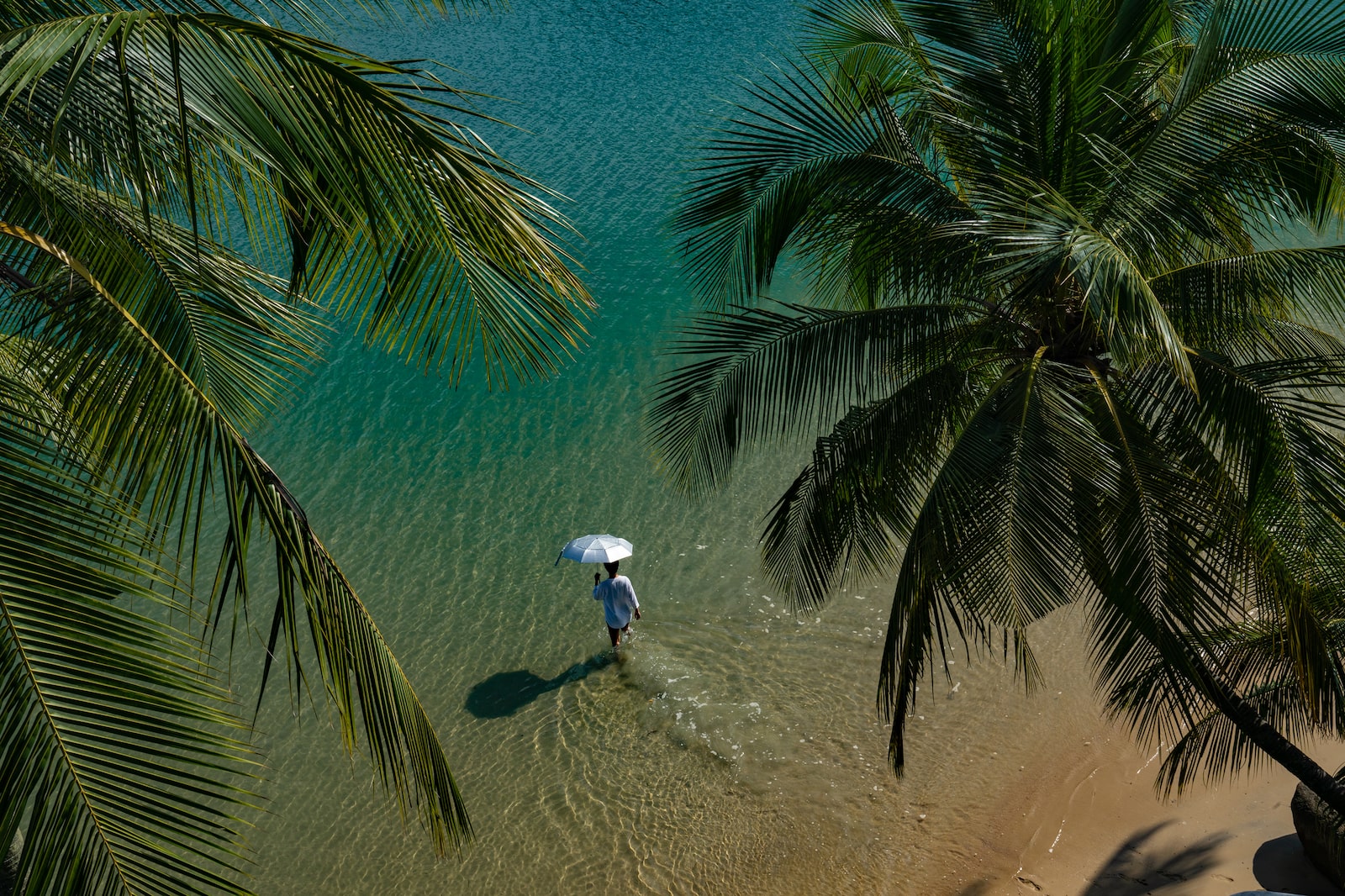 Stranger walking through clear waters in Sentosa