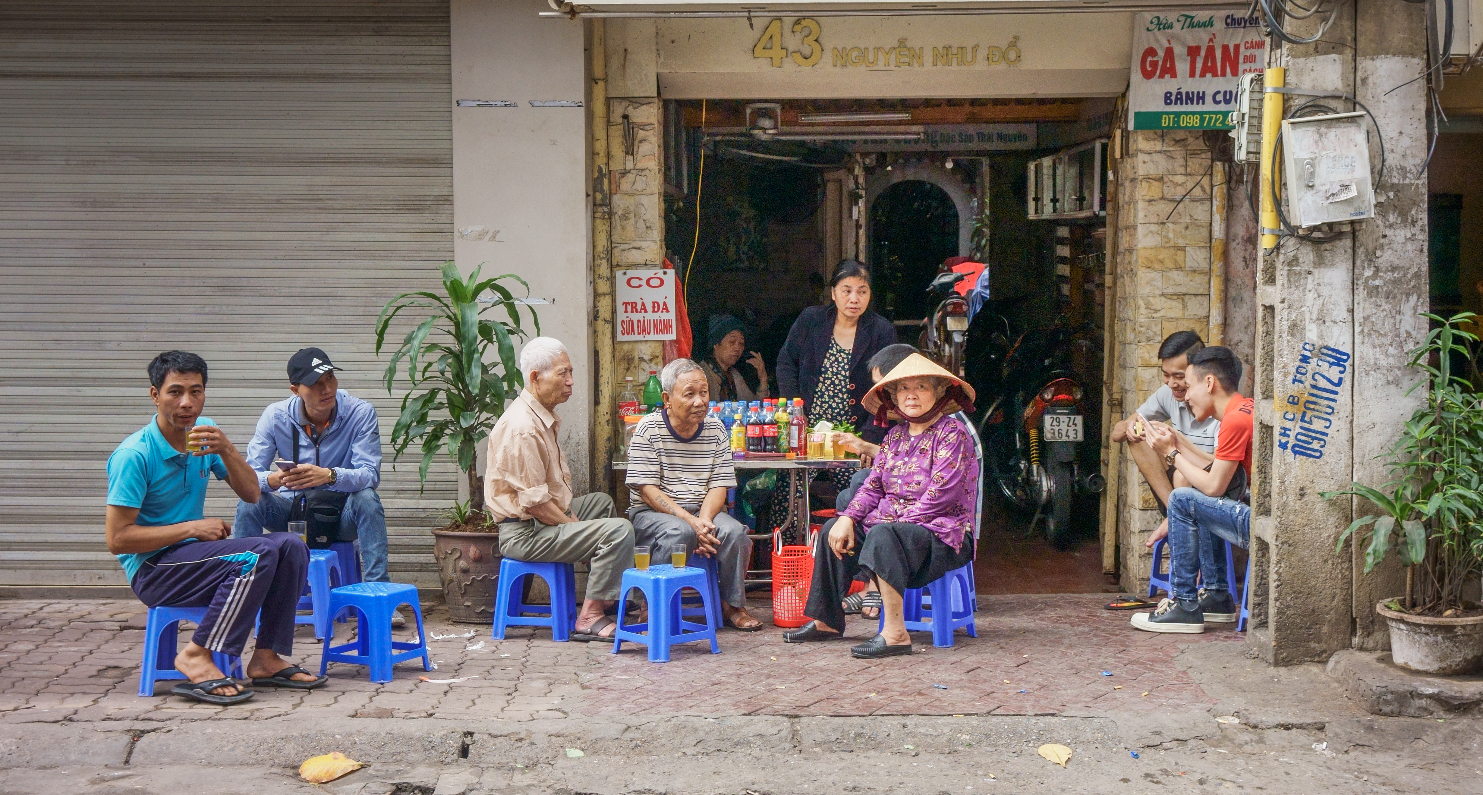 Street photography of people on the road side of Vietnam